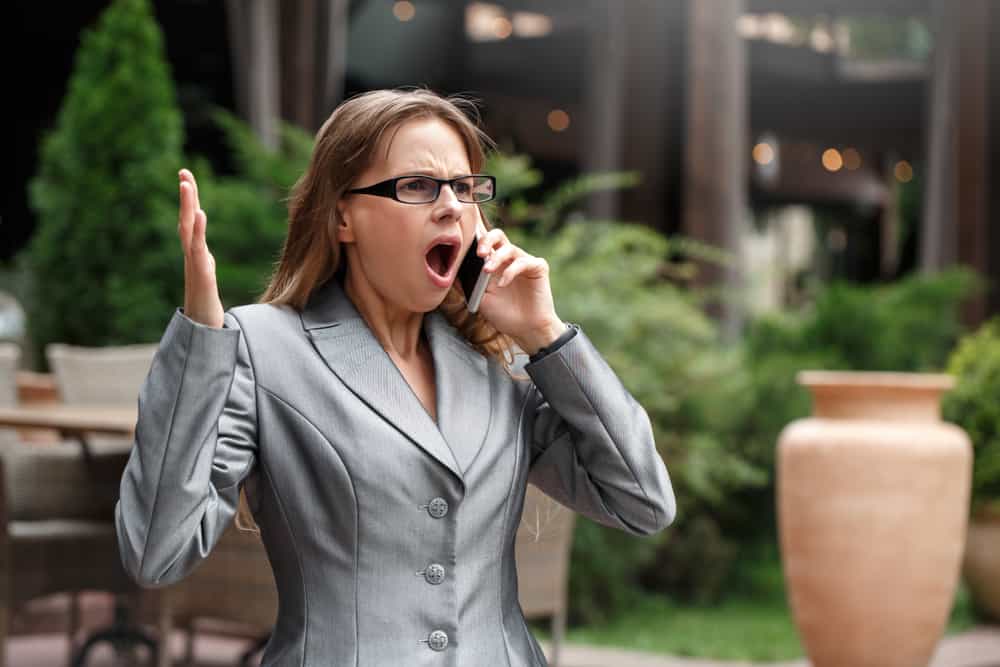 woman having a really difficult conversation on the phone