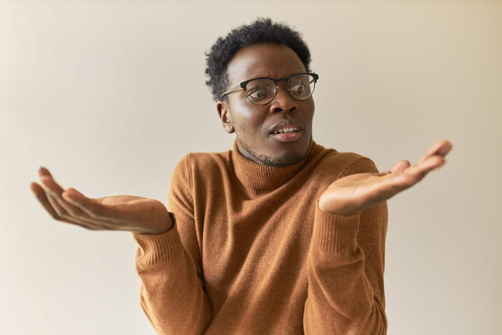 Man weighing up positives and negatives