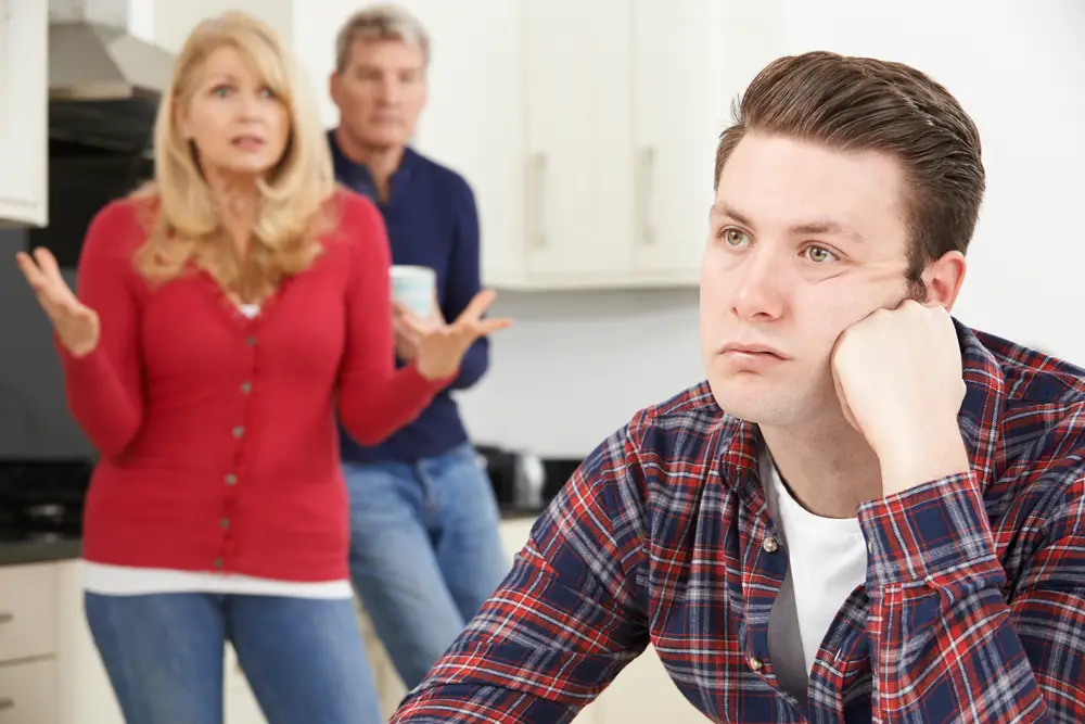 Adult man visiting his parents